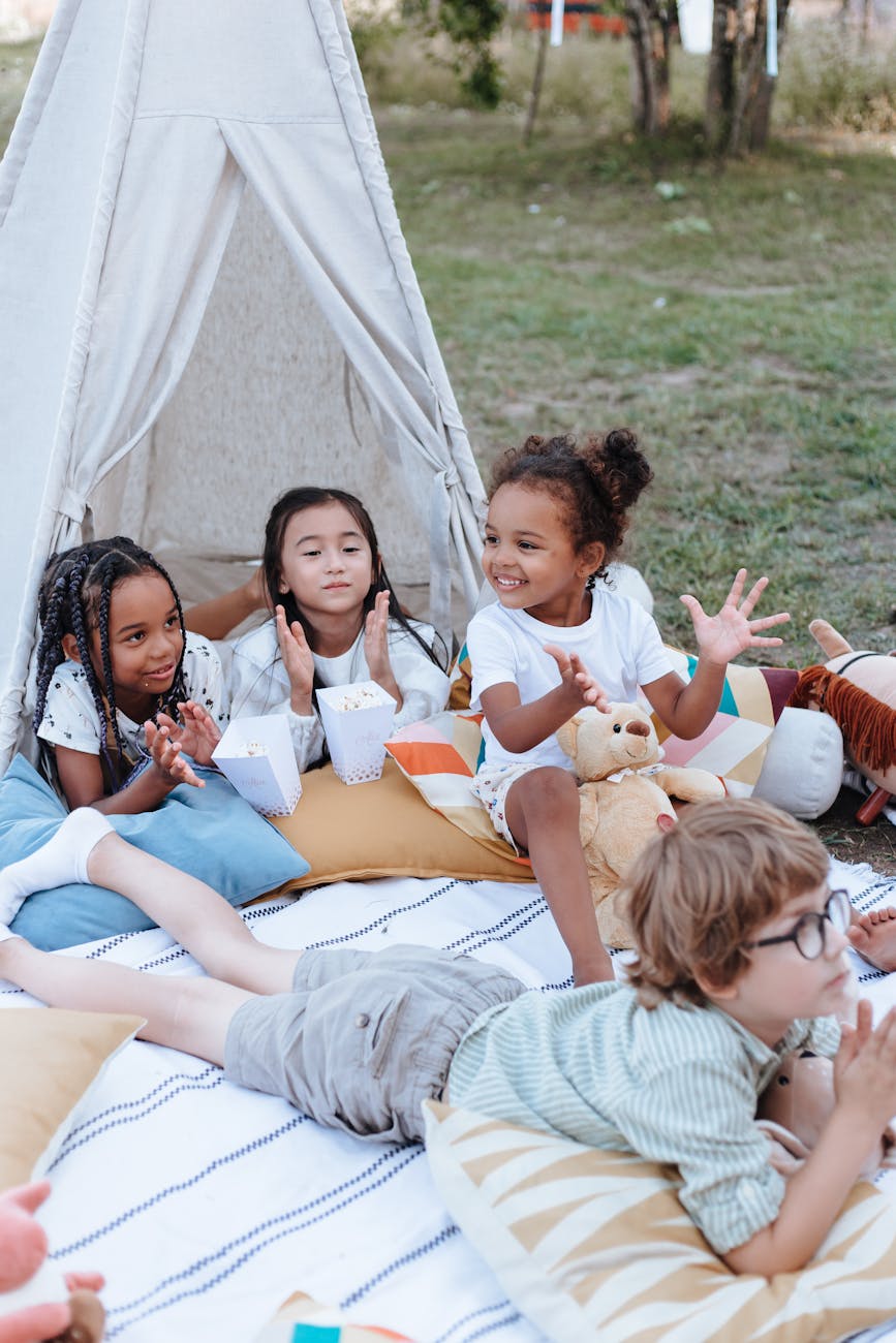 happy kids outside teepee